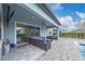Covered patio with seating and pool view at 8024 Leaf Grove Cir, Orlando, FL 32836