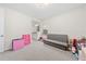 Playroom with gray couch and ample space for ' activities at 8024 Leaf Grove Cir, Orlando, FL 32836