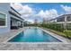 Relaxing rectangular pool with tanning ledge at 8024 Leaf Grove Cir, Orlando, FL 32836