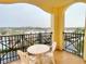 Private balcony with table and chairs, offering an outdoor seating area at 8100 Poinciana Blvd # 2405, Orlando, FL 32821