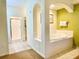 Relax in this spa-like bathroom, featuring a large soaking tub and separate shower at 8100 Poinciana Blvd # 2405, Orlando, FL 32821
