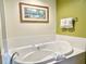 Bathroom with a large jacuzzi tub at 8100 Poinciana Blvd # 2405, Orlando, FL 32821