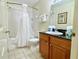 Bathroom with tub shower, vanity, and toilet at 8100 Poinciana Blvd # 2405, Orlando, FL 32821