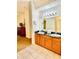 Double vanity bathroom with granite countertops at 8100 Poinciana Blvd # 2405, Orlando, FL 32821
