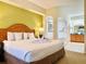 King bed with en-suite bathroom and bathtub at 8100 Poinciana Blvd # 2405, Orlando, FL 32821