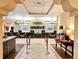 Lobby with front desk and comfortable seating area at 8100 Poinciana Blvd # 2405, Orlando, FL 32821