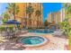 Resort-style pool with hot tub and lounge chairs at 8100 Poinciana Blvd # 2405, Orlando, FL 32821