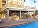 Swim-up bar with seating and outdoor umbrellas at 8100 Poinciana Blvd # 2405, Orlando, FL 32821