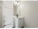 Clean bathroom with white vanity and a mirror at 901 Marcello Blvd, Kissimmee, FL 34746