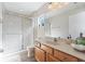 Bathroom with shower, toilet and wood vanity at 901 Marcello Blvd, Kissimmee, FL 34746
