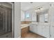 Bathroom with soaking tub, walk-in shower, and white cabinets at 901 Marcello Blvd, Kissimmee, FL 34746