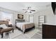 Spacious bedroom with ceiling fan, large bed, and built-in shelving at 901 Marcello Blvd, Kissimmee, FL 34746