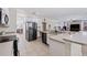 Modern kitchen with stainless steel appliances and an island at 901 Marcello Blvd, Kissimmee, FL 34746