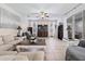 Spacious living room with ample seating, large TV, and tile floors at 901 Marcello Blvd, Kissimmee, FL 34746