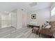 Upstairs sitting area featuring a comfortable armchair and bench at 901 Marcello Blvd, Kissimmee, FL 34746