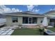 Home with solar panels, screened patio, and artificial turf at 1015 Sabine Pl, Kissimmee, FL 34759