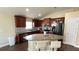 Kitchen with granite island, wood cabinets, and stainless steel appliances at 1015 Sabine Pl, Kissimmee, FL 34759