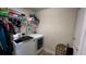 Laundry room with washer, dryer, and shelving unit at 1015 Sabine Pl, Kissimmee, FL 34759