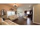 Open floor plan with living room, kitchen, and dining area at 1015 Sabine Pl, Kissimmee, FL 34759