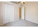 Bright bedroom with double door closet and carpet at 10398 Stone Glen Dr, Orlando, FL 32825