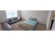 Bedroom with queen bed, carpet, and a sofa at 1057 Cambridge Dr, Winter Haven, FL 33881