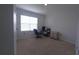 Bright bedroom with carpeted floor and built-in desk at 1057 Cambridge Dr, Winter Haven, FL 33881