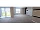 Spacious living room with large window and neutral carpet at 1057 Cambridge Dr, Winter Haven, FL 33881