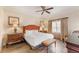 Serene bedroom features a plush bed, framed art and tiled floors at 1108 Sunset View Cir # 204, Reunion, FL 34747