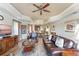 Comfortable living area featuring leather sofas, wood-look tile and open layout at 1108 Sunset View Cir # 204, Reunion, FL 34747