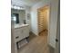 Bathroom featuring a single sink vanity, wood-look flooring, and a shower/bath at 1158 Sand Torch, Davenport, FL 33837