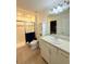 Bathroom features a glass enclosed shower and white vanity with a light countertop at 1158 Sand Torch, Davenport, FL 33837