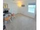 Bedroom with neutral carpet, a window, and a double door closet at 1158 Sand Torch, Davenport, FL 33837