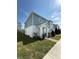Inviting two-story townhome with blue and white siding, a well-manicured lawn, and easy access to the sidewalk at 1158 Sand Torch, Davenport, FL 33837
