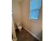 Small bathroom with toilet and window blinds at 122 Macaulays Cv, Haines City, FL 33844