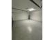 Attached garage with ample space for parking and storage at 122 Macaulays Cv, Haines City, FL 33844