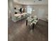 Modern kitchen with island, white countertops, and stainless steel appliances at 122 Macaulays Cv, Haines City, FL 33844
