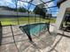 Screened pool and patio with safety fence at 122 Macaulays Cv, Haines City, FL 33844