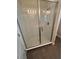 Walk-in shower with glass enclosure and neutral tile surround at 122 Macaulays Cv, Haines City, FL 33844