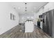 Modern kitchen with white cabinets and stainless steel appliances at 127 Dorchester Ct, Kissimmee, FL 34758