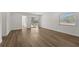 Spacious bedroom with wood-look flooring and access to patio at 13404 Sw 60Th Court Rd, Ocala, FL 34473