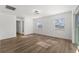 Large bedroom with wood-look floors and two windows at 13404 Sw 60Th Court Rd, Ocala, FL 34473