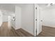 Bright hallway with light wood flooring leading to other rooms at 13404 Sw 60Th Court Rd, Ocala, FL 34473