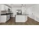 Modern kitchen with an island, stainless steel appliances, and white cabinets at 13404 Sw 60Th Court Rd, Ocala, FL 34473