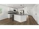 Modern kitchen with an island, stainless steel appliances, and white cabinets at 13404 Sw 60Th Court Rd, Ocala, FL 34473