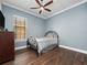 Cozy bedroom with wood flooring and ceiling fan at 1632 Nina Dr, Davenport, FL 33837