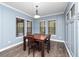 Formal dining room with hardwood floors and a wood dining set at 1632 Nina Dr, Davenport, FL 33837