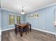 Bright dining room with hardwood floors and wood dining table at 1632 Nina Dr, Davenport, FL 33837