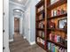 Bright hallway with built-in shelving and view to bedroom at 1632 Nina Dr, Davenport, FL 33837