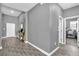 Entryway with gray walls, tile floors, and view to office at 1783 Can Do Way, Kissimmee, FL 34744