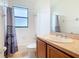 Simple bathroom with shower/tub combo and vanity at 203 Los Gatos Pl, Poinciana, FL 34759